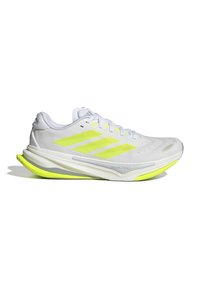 White athletic shoes with a textured upper, featuring yellow-green accents and three stripes design. Lightweight sole for enhanced performance.