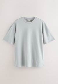 Helehall, lühikeste varrukatega T-särk, valmistatud pehmest puuvillast. Omadusteks on ümarsäär, lõdvestunud istuvus ja sile pind.