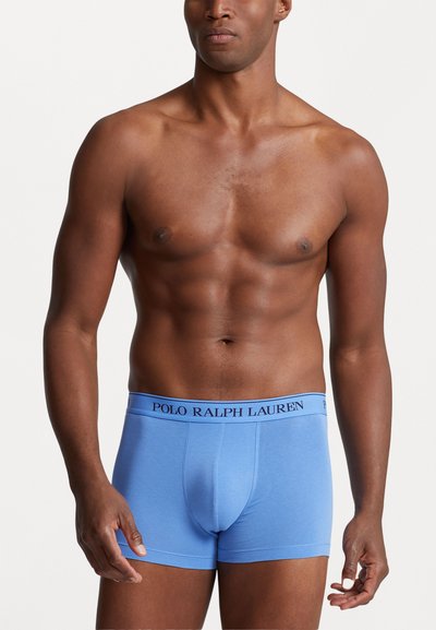 Boxer-briefs en coton bleu au design ajusté, dotés d'une taille contrastante noire portant l'inscription "POLO RALPH LAUREN." Texture lisse.