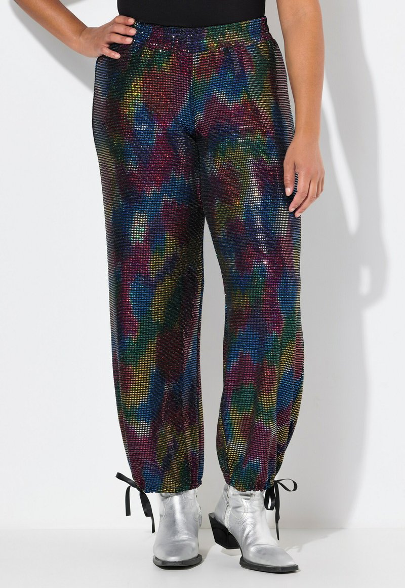 Pantalones de lentejuelas multicolores con un ajuste holgado y cinturilla elástica. Presentan puños fruncidos con lazos, textura brillante y patrones vibrantes.
