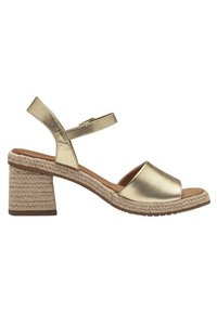 Gold metallic heeled sandals with a closed toe design. Espadrille-style woven platform and block heel. Adjustable ankle strap.