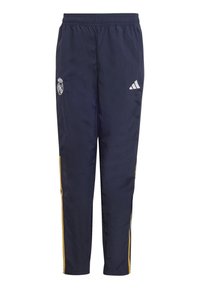 Pantalones deportivos navy con una cintura elástica, que presentan el logo blanco de Adidas y el emblema del Real Madrid, complementados por franjas amarillas a los lados.