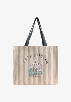 Beežide triipudega kandekott mustade käepidemetega, millel on värvikas lilleturupilt ja tekst "Cath Kidstoni lille turg."