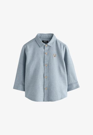 Svijetloplava košulja dugih rukava od mekog materijala s prednjim kopčanjem na gumbi i malim刺刺em medvjedića na prsima. Okrugli ovratnik, klasičan kroj.