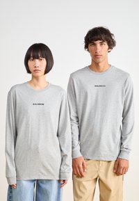 Salomon LOGO TEE UNISEX - T-shirt estampada - heather grey