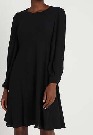Black dress with long, puffed sleeves and a round neckline. The fabric is smooth, featuring a flared hem and subtle seam details.