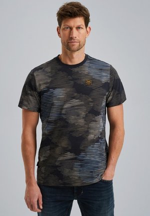 Short-sleeve black t-shirt featuring a wavy blue and beige striped pattern, round neckline, and a small branded patch on the chest.
