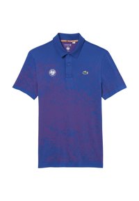 Blå pikétröja med en gradientmönster, med en grön Lacoste-logotyp och en rund Roland Garros-patch på bröstet. Kortsleeves, krage.