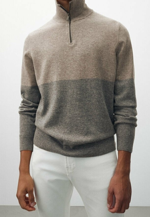 Knit pullover in light brown, featuring a gray band at the midsection, high collar with a quarter-zip. Soft texture and fitted sleeves.