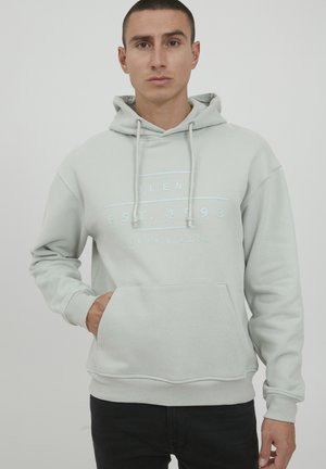 Light gray hooded sweatshirt made of soft fabric with a kangaroo pocket. Features a printed logo in blue and drawstrings for the hood.