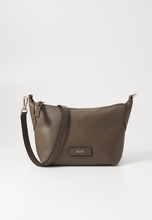 Brown leather crossbody bag with textured surface, gold hardware, and a top zipper. Features an adjustable strap and branded tag.