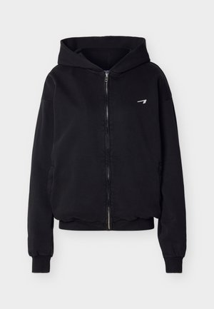 Black zip-up hoodie with front pockets, ribbed cuffs and hem, small white logo on left chest, displayed on a light background.