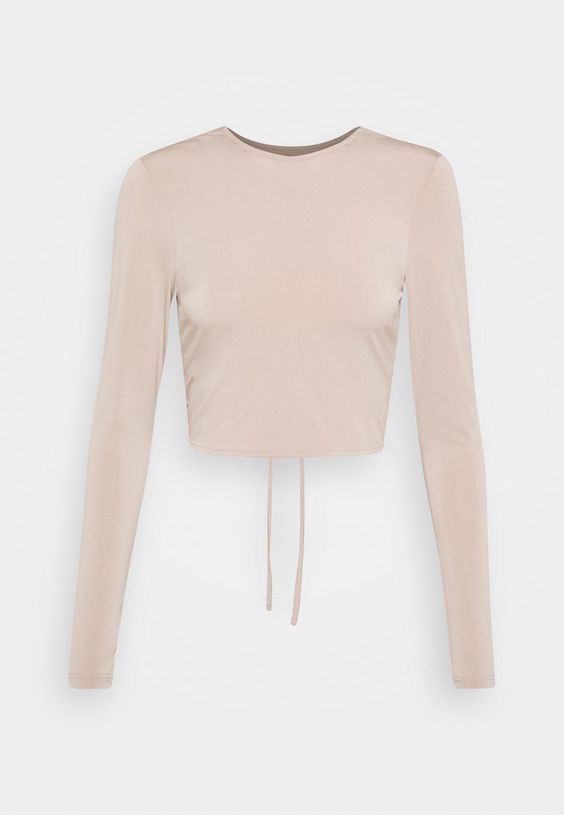 Light beige long-sleeve cropped top with a round neckline and drawstring detail at the hem. Made of smooth, slightly glossy fabric.