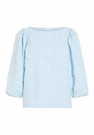 Gaiši zilā teksturētā blūze ar uzpučītiem gariem piedurknēm un platu apaļu izgriezumu.