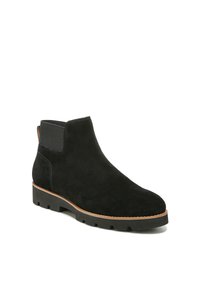 Schwarze Wildleder-Ankle-Boots mit elastischen Seiteneinsätzen, runder Zehenpartie und strukturiertem Gummisohle. Mit einem hellbraunen Rand um die Sohle.