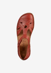Red leather sandal with cutout design and woven details. Features a cushioned insole and a textured sole for grip.