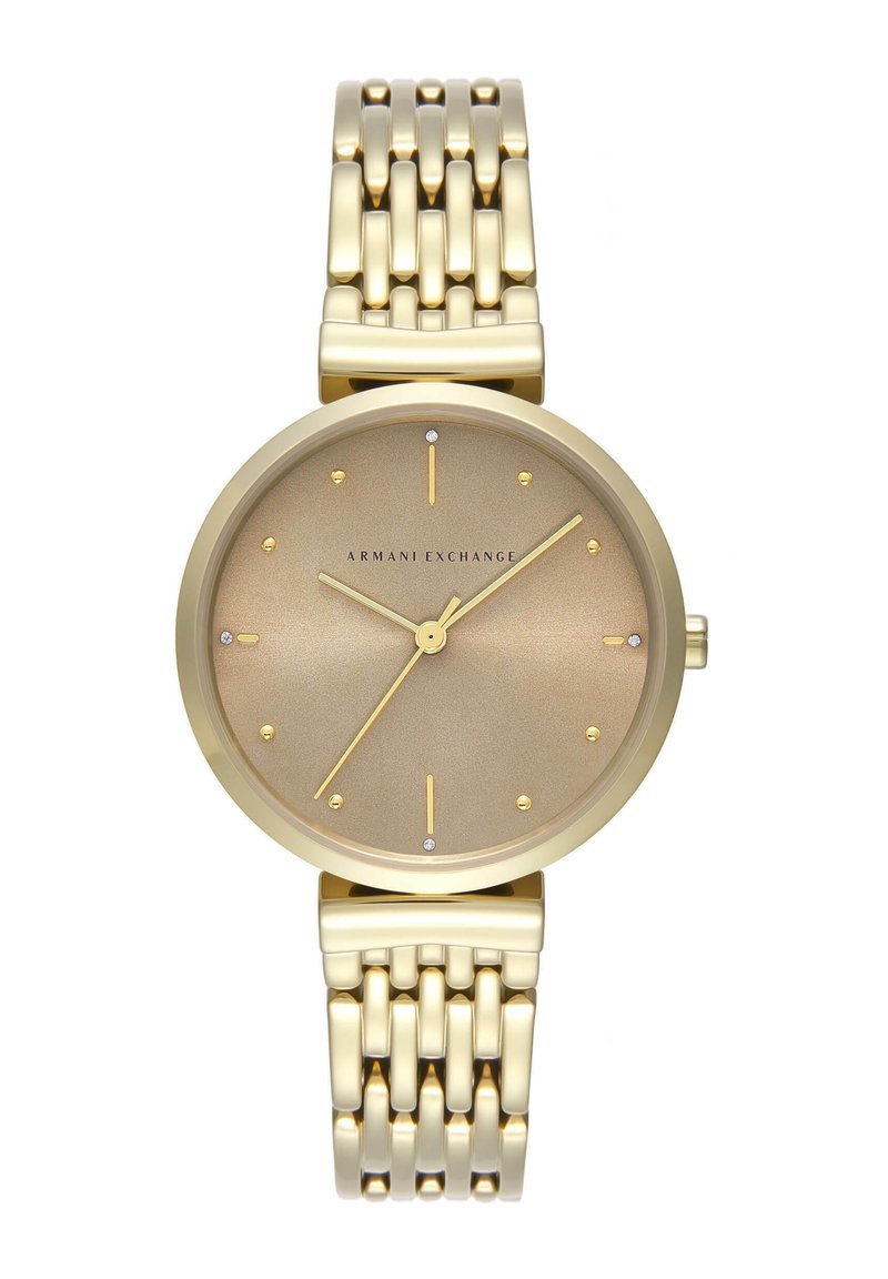 Orologio dorato con quadrante rotondo spazzolato, indicatori delle ore minimalisti e bracciale in metallo con motivo a zigzag. Logo del marchio visibile.
