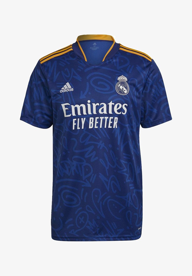 Blue short-sleeve jersey with a graphic pattern, featuring Adidas logo, "Emirates Fly Better" text, and Real Madrid crest. Gold accents on collar.