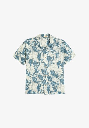 Chemise à manches courtes en crème clair avec un motif floral et de feuilles bleues, conception avec col, et cinq boutons en bois sur le devant.