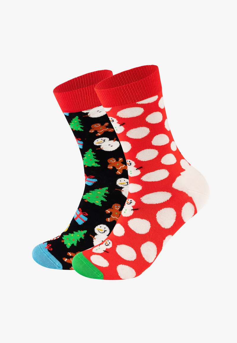Koksokker med svart design med julmotiver og røde sokker med hvite prikker. Stripete mansjett og kontrastfarget tå.