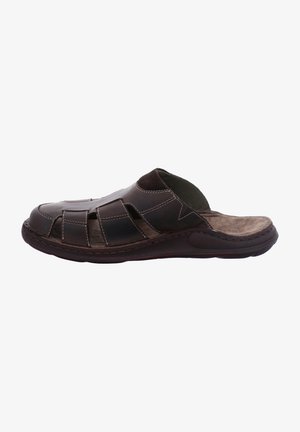 Brown leather slip-on sandal with cut-out design, stitching accents, rounded toe, and textured insole. Flexible rubber sole for comfort.