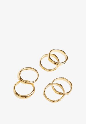 Set of six gold rings featuring various designs: smooth, twisted, and textured finishes with round and hexagonal shapes.