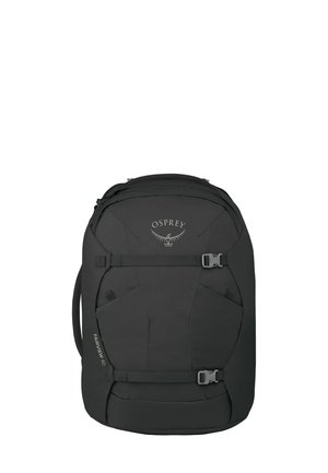 Sac à dos de voyage noir Osprey Fairview 40 avec sangles de compression frontales et poignée latérale, conçu pour un emballage organisé et un transport facile.