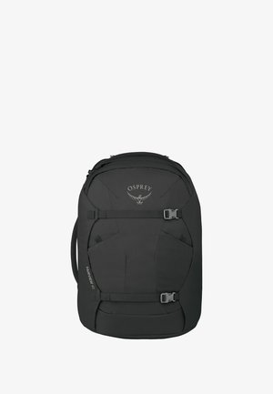Sac à dos de voyage noir Osprey Fairview 40 avec sangles de compression frontales et poignée latérale, conçu pour un emballage organisé et un transport facile.