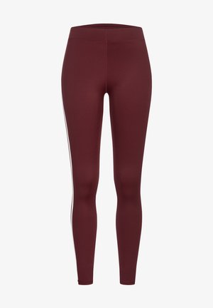Leggings bordeaux au design ajusté, fabriqués en tissu extensible, avec des rayures blanches sur les côtés et une texture lisse. Pas de matériel visible.