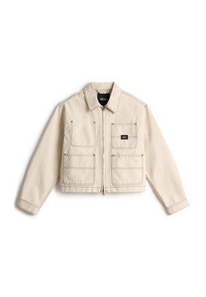 Light beige zip-up jacket with four front pockets featuring dark stitching and a small black Vans logo patch on the upper right pocket.