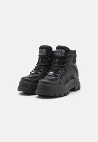 Buffalo ASPHA HYB MID - Aulinukai su platforma - black