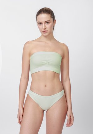 Lysegrøn ribbet bandeau-top og matchende trusse med samling i midten og sømløse kanter. Blødt stof med en glat tekstur.