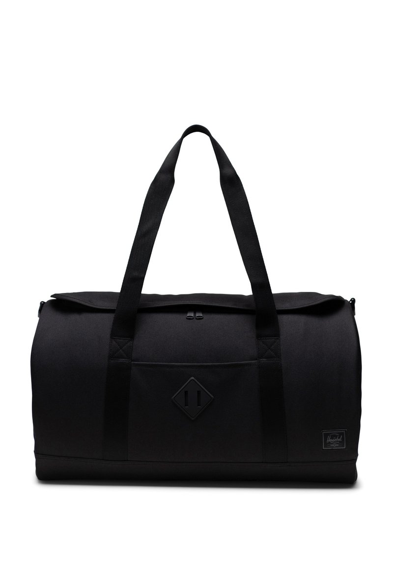 Sac de sport noir en forme arrondie, en matériau textile, avec deux poignées supérieures, fermeture zippée et une poche avant avec un écusson en forme de diamant.
