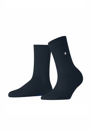 Chaussettes en coton bleu marine avec texture côtelée, talon renforcé et un petit logo sur le côté. Design classique et longueur mi-mollet.