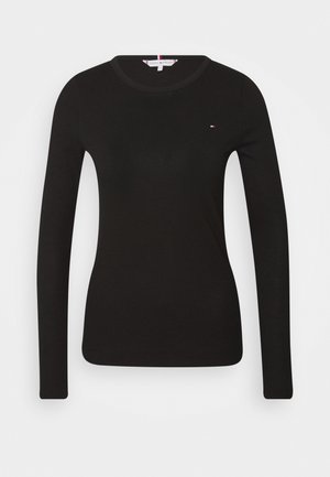 Schwarzes langärmeliges, figurbetontes Strickoberteil mit rundem Halsausschnitt und kleinem Tommy Hilfiger-Logo auf der linken Brust.