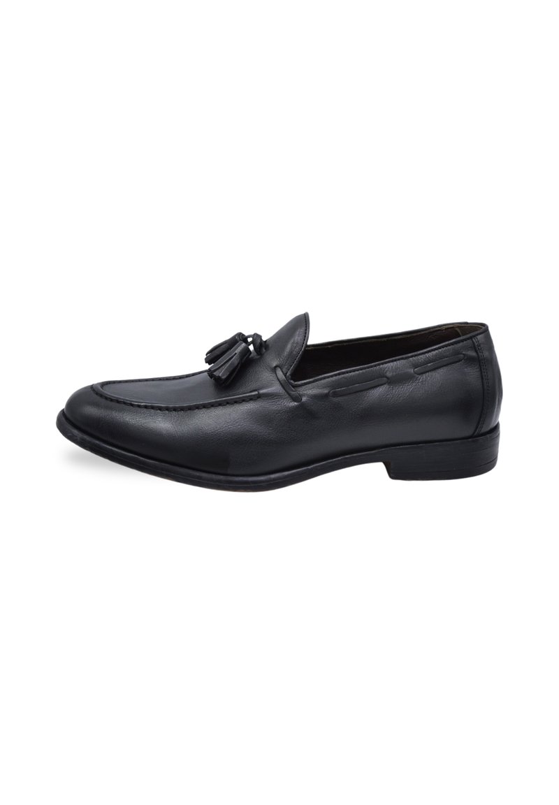 Black leather loafers with tassel detail, featuring a stitched design and flat sole. Smooth texture with a classic shape.