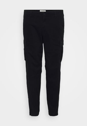 Black cargo pants made of cotton with a slim fit. Features side pockets and elastic cuffs at the ankles. Minimalistic design with a smooth texture.