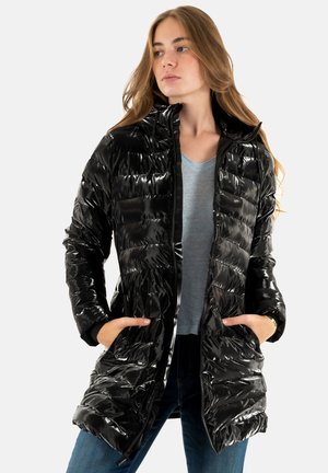 Black glossy puffer jacket with a zip front, hood, and side pockets. Features a quilted design with horizontal stitching, paired with a blue top.