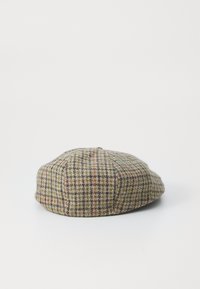 Wool cap with a houndstooth pattern featuring green, brown, and orange accents. Round shape with a flat top and textured surface.
