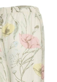 Pantalon à taille élastique en tissu crème avec un imprimé floral pastel de fleurs roses, jaunes et bleues avec des tiges et feuilles vertes.