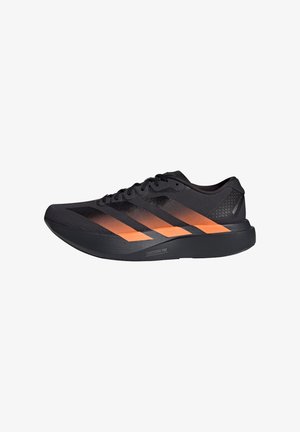 Black athletic shoes with orange accents, featuring a textured upper, prominent stripes, a lightweight sole, and a streamlined design.