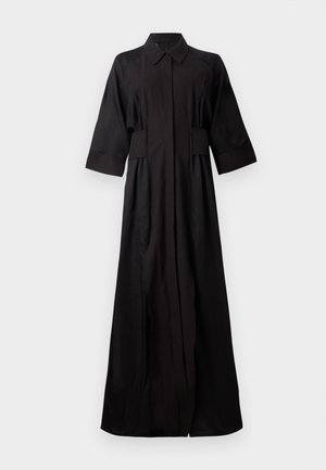 Črna, obleka s dolgimi rokavi, narejena iz gladkega blaga. Ima ovratnik, gumbasto zapiranje in stranske žepe, s sproščenim fitom in ravnim krojem.