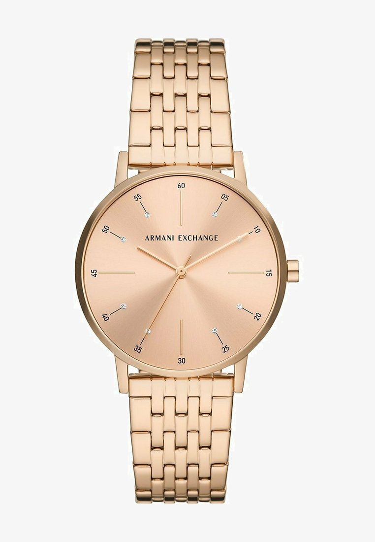 Roséguld armbandsur med en minimalistisk rund urtavla, en borstad metallskiva, stavtimmarkörer och ett flätat armband.