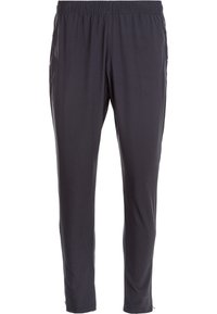 Zwarte elastische taille broek gemaakt van glad, lichtgewicht stof. Tapered ontwerp met zijzakken en subtiele stiksels.