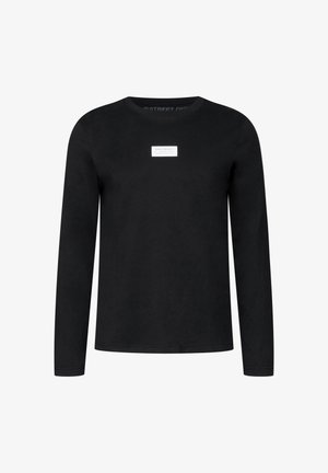 T-shirt noir à manches longues en coton, avec un col rond et une petite étiquette rectangulaire de la marque sur la poitrine.