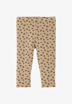 Ribbed beige leggings with a leopard print pattern in brown tones. Features an elastic waistband and fitted ankle length.