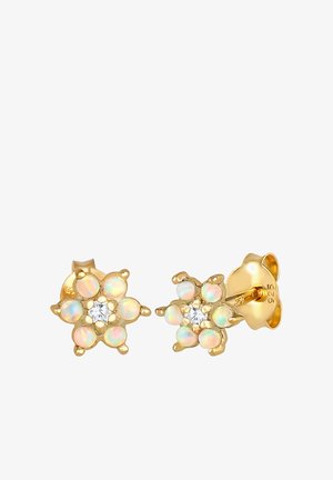 Boucles d'oreilles en forme de fleurs en or, ornées de six gemmes d'opale et d'un cristal clair au centre. L'arrière est également en ton or, avec des marques visibles.