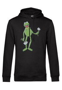 Un sweat à capuche noir avec un personnage de grenouille de dessin animé vert tenant des fleurs. Le matériau semble doux, avec une coupe décontractée et une capuche à cordon.