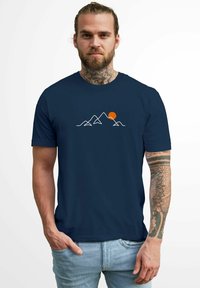 Navy blue t-shirt made of cotton featuring a white mountain graphic with an orange sun, short sleeves, and a crew neck design.