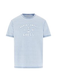 T-shirt en coton bleu clair avec le texte "WORLD FAMOUS 1981" et un motif d'ancre brodé en blanc. Col rond et manches courtes.